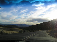 [Clouds and Bug Splatter. Note the conical mountain and cloud whorl in the next pictures]